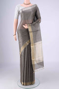 Davys Grey Tussar Silk Saree with Checked design on the body and Zari Border.  displayed on a mannequin