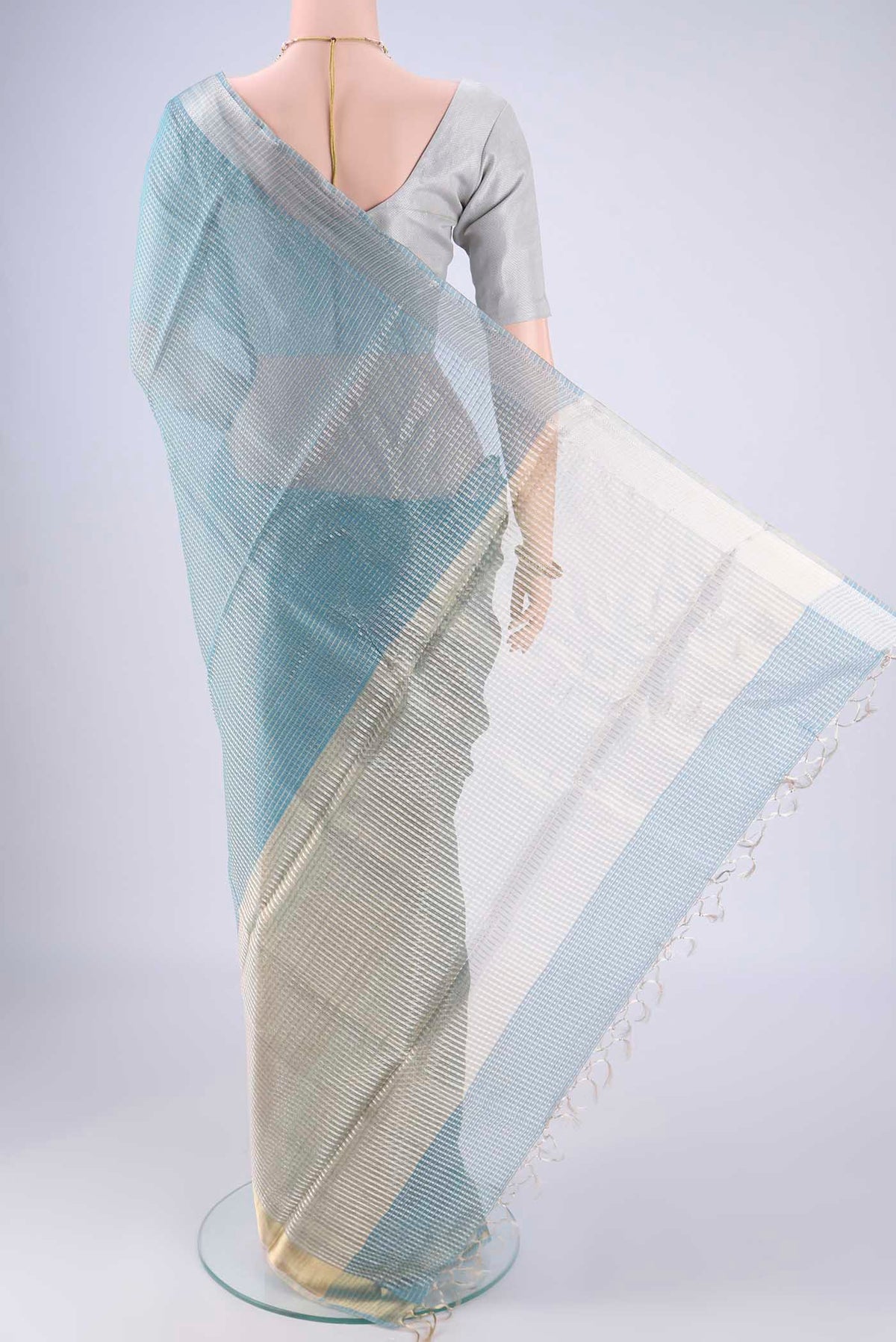 Flat view of Sky Blue MP Tussar Saree with Checked design on the body and Zari Border. 