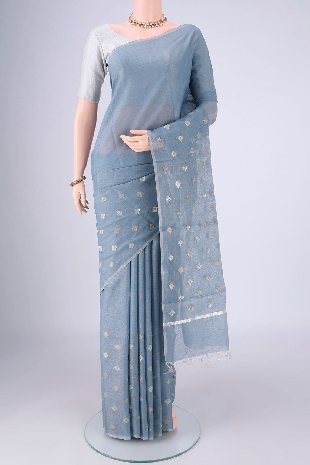 Sky Blue MP Tussar Saree with Zari Butta on the body and Thin Zari Line.  displayed on a mannequin