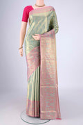 Sea Green Dual Tone Kanchipuram Tissue Silk Saree with Zari Brocade on the body and Zari Border.  displayed on a mannequin