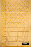 Gold Dual Tone Kanchipuram Tissue Silk Saree with Zari Brocade on the body and Zari Border.  displayed on a mannequin