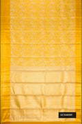 Gold Dual Tone Kanchipuram Tissue Silk Saree with Zari Brocade on the body and Zari Border.  displayed on a mannequin
