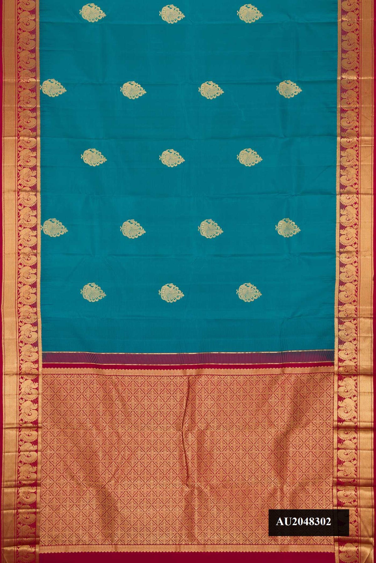 Peacock Blue Dual Tone Kanchipuram Silk Saree with Zari Butta on the body and Zari Border.  displayed on a mannequin
