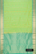 Parrot Green Dual Tone Kanchipuram Silk Saree with Zari Butta on the body and Zari Border.  displayed on a mannequin