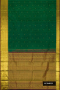 Bottle Green Dual Tone Kanchipuram Silk Saree with Zari Butta on the body and Zari Border.  displayed on a mannequin