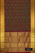 Mehandi Green Dual Tone Kanchipuram Silk Saree with Zari Butta on the body and Zari Border.  displayed on a mannequin