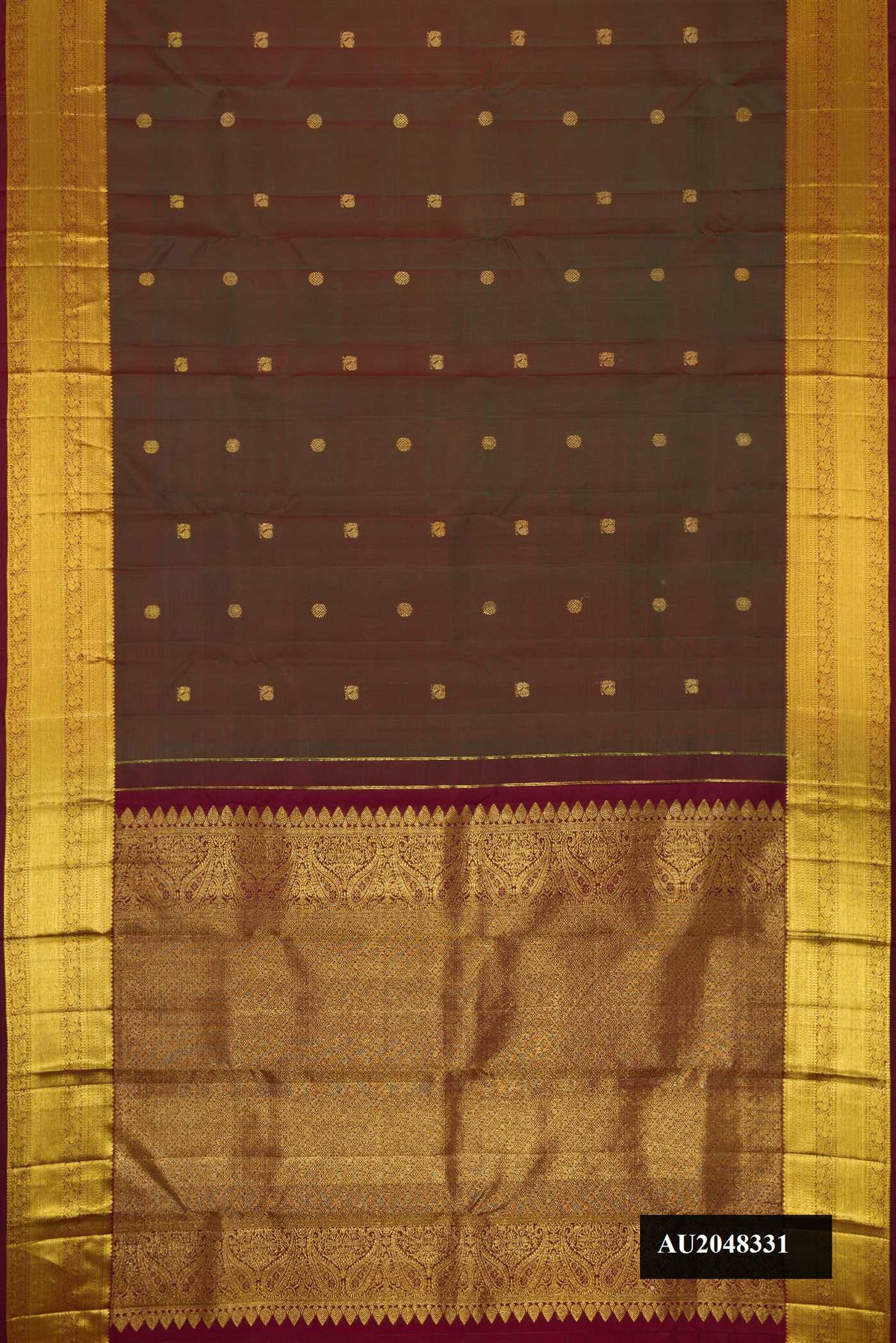 Mehandi Green Dual Tone Kanchipuram Silk Saree with Zari Butta on the body and Zari Border.  displayed on a mannequin