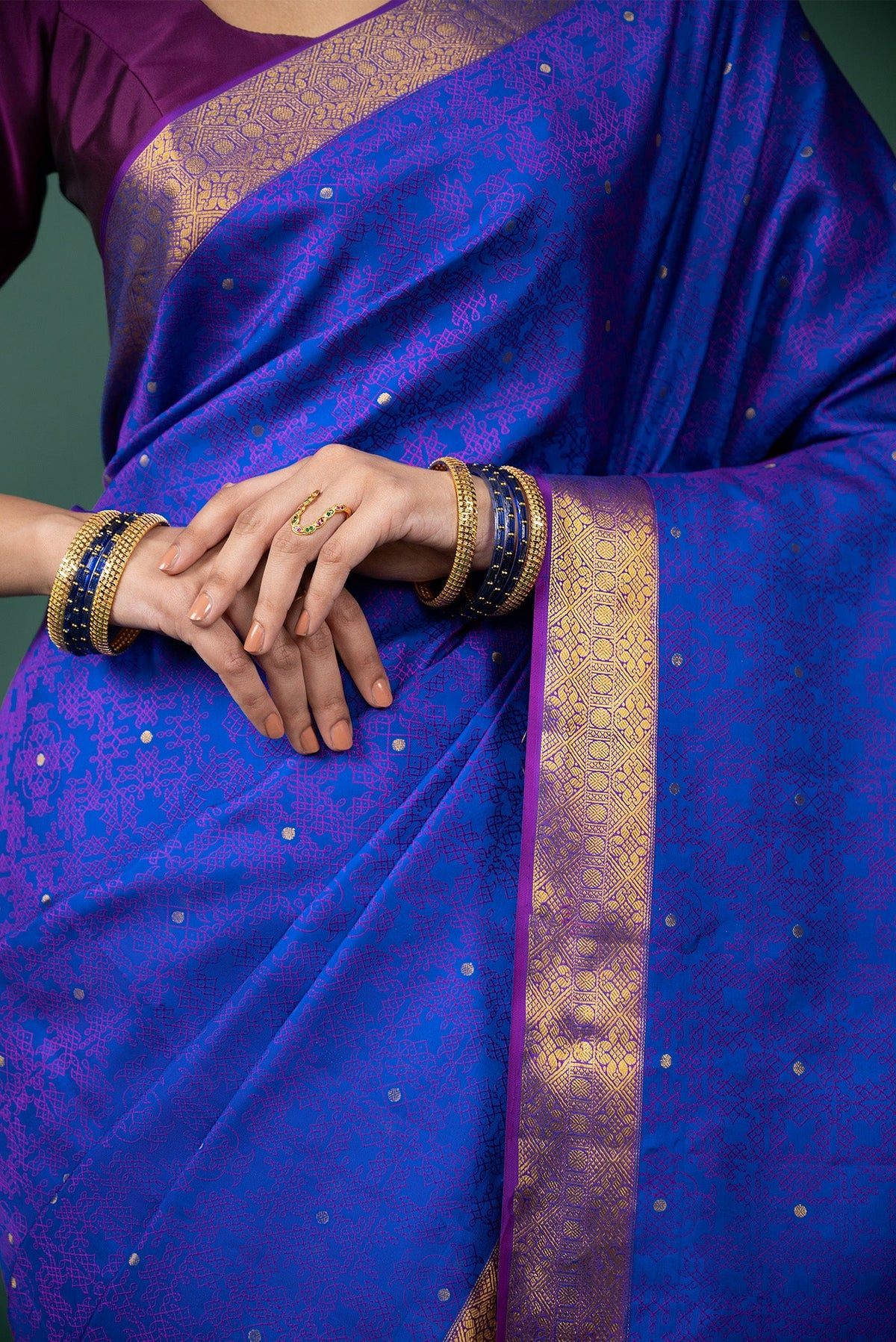 Close up image of the blouse of Blue Kanchipuram Silk Saree with Jacquard With Zari Butta on the body and Zari Border