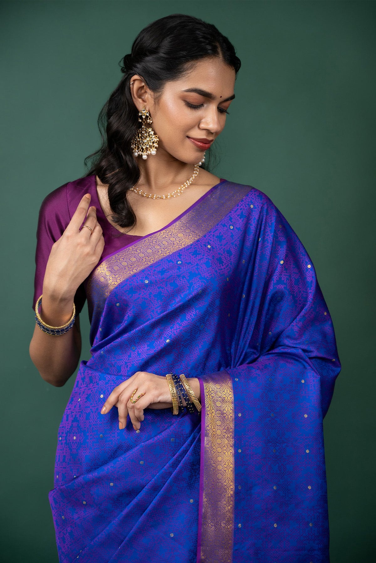 Close up of Blue Kanchipuram Silk Saree with Jacquard With Zari Butta on the body and Zari Border displaying folds