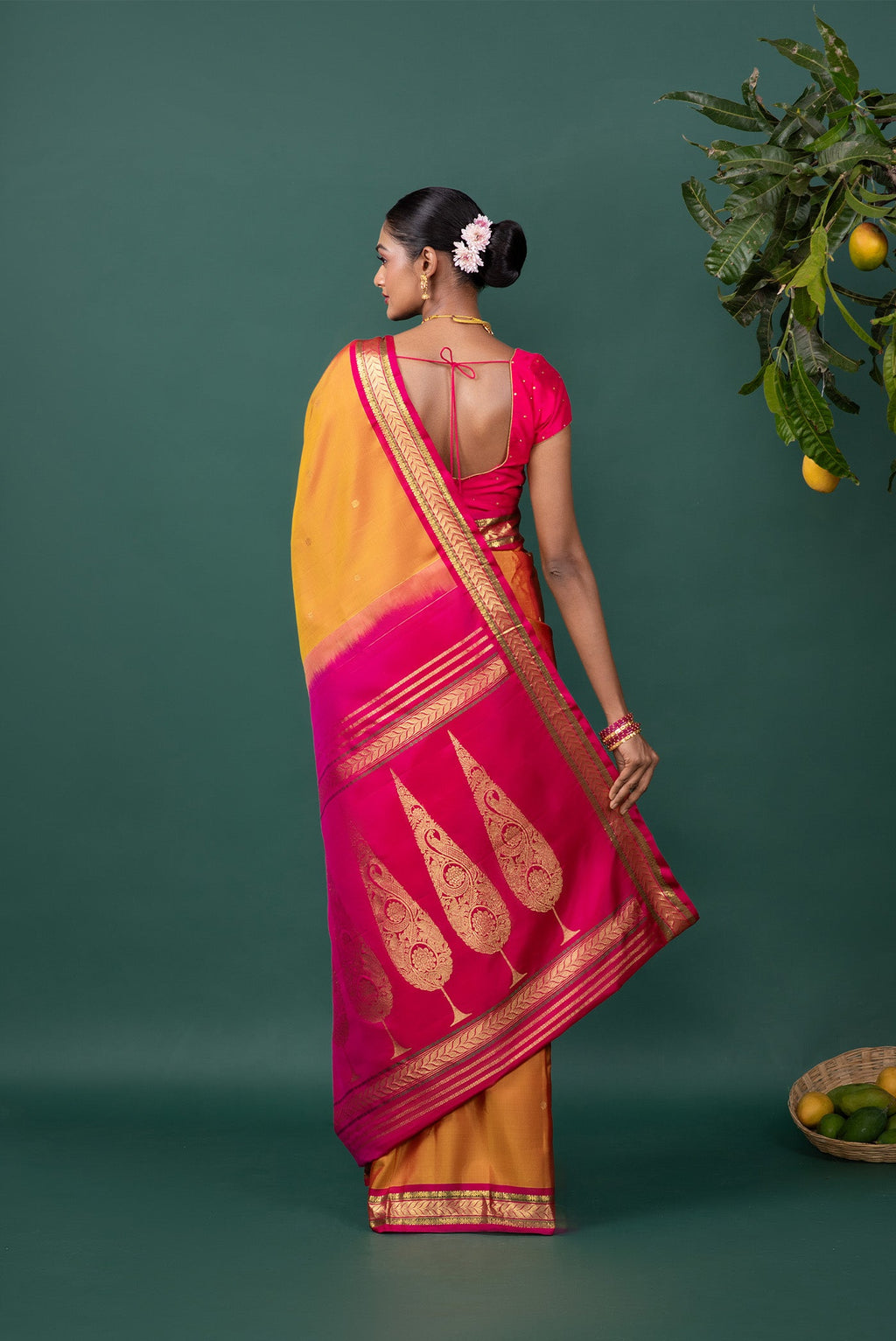 Close up image of the pallu of Mustard Kanchipuram Silk Saree with Zari Butta on the body and Zari Border