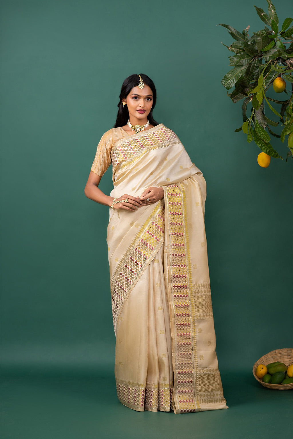Beige Kanchipuram Silk Saree with Zari Butta on the body and Zari And Thread Border displayed on a mannequin