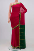 Maroon Mysore Crepe Saree with Plain Body and Zari Border.  displayed on a mannequin