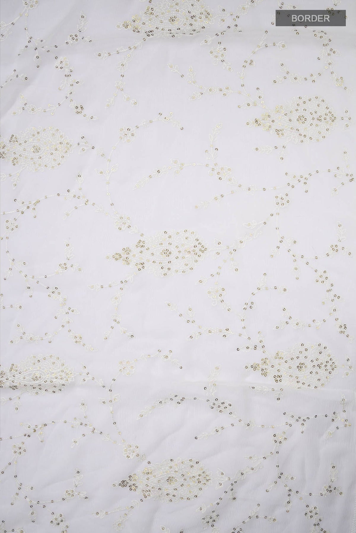 Border image of Cream Blended Chiffon Saree with Embroidery on the body and Lace Border. 