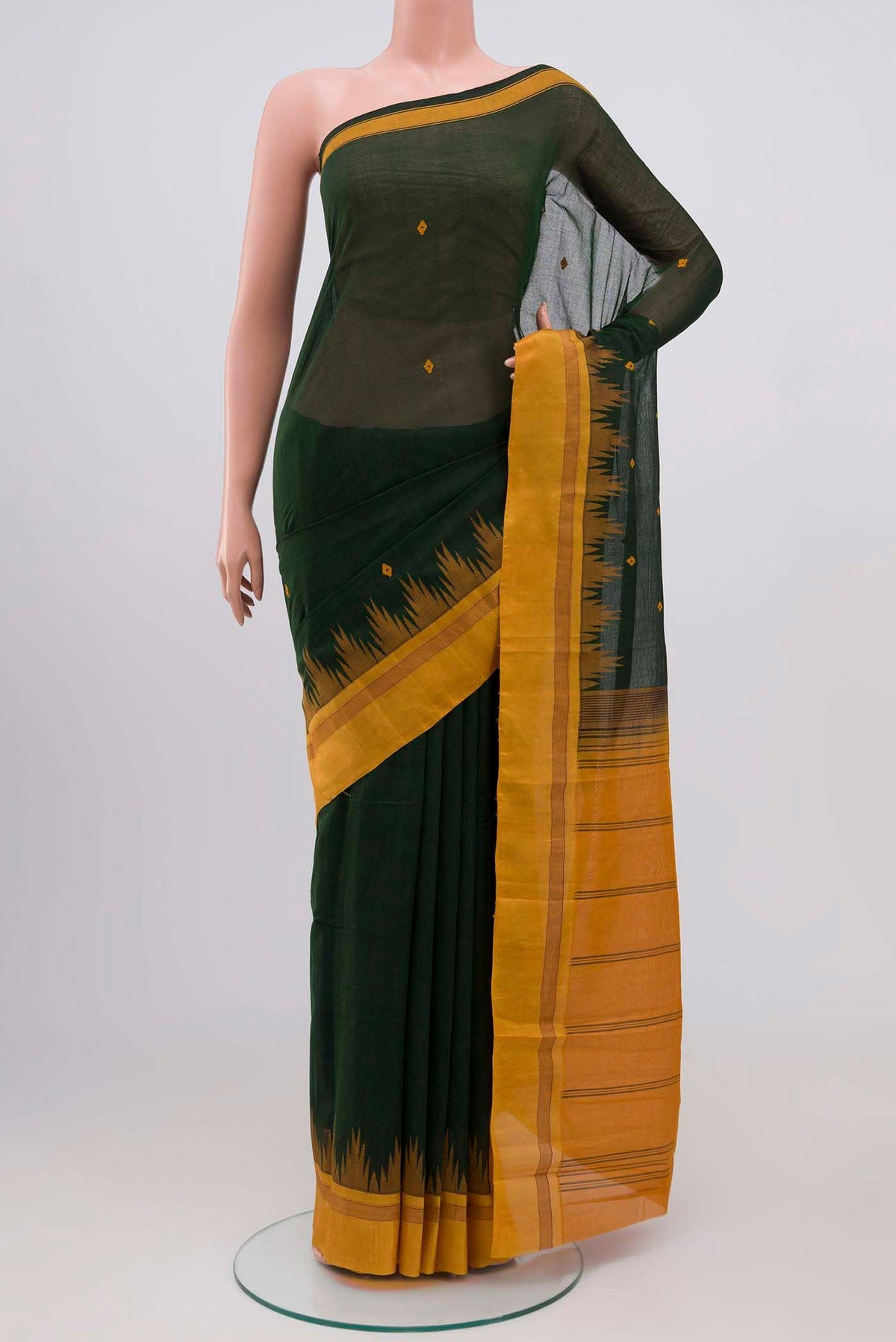 Green Kanchi Cotton Saree with Thread Butta on the body and Silk Border.  displayed on a mannequin