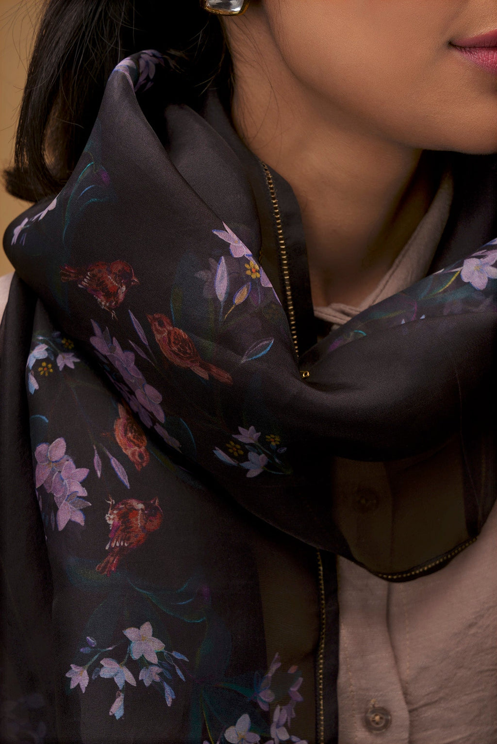 Close up of Black Pure Organza Silk Saree with Bird Print on the body and Without Border displaying folds
