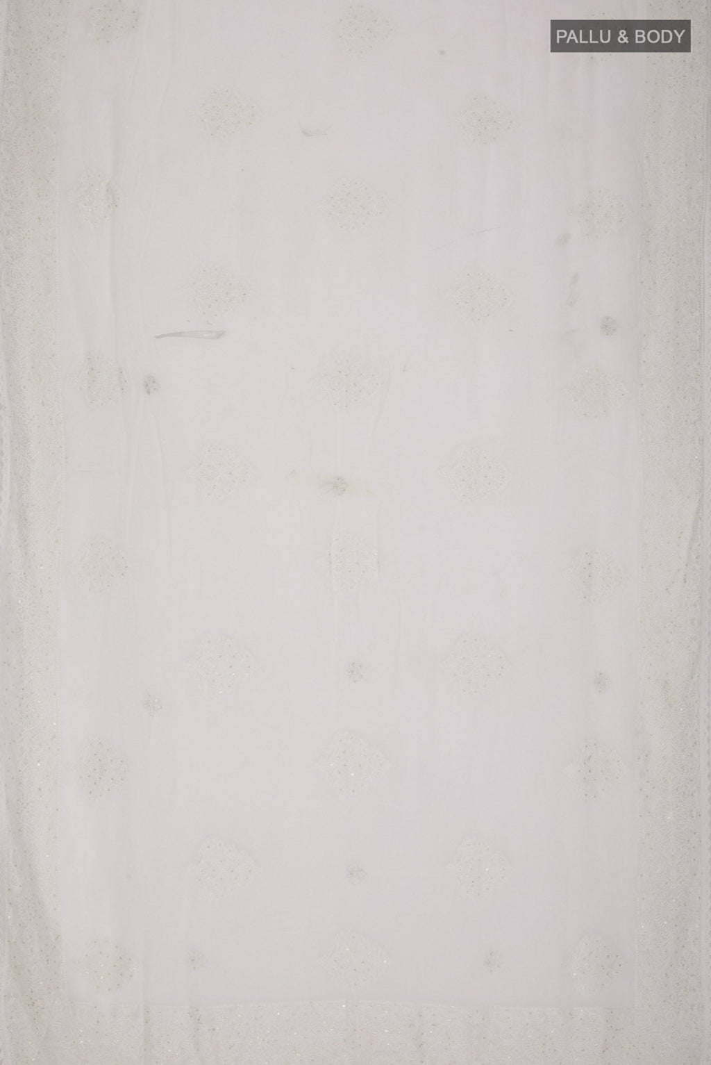 Flat view of White Blended Chiffon Saree with Embroidery on the body and Embroidery Border. 