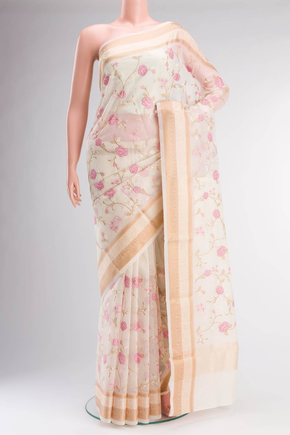 Cream Blended Kota Cotton Saree with Embroidery on the body and Thread Border.  displayed on a mannequin
