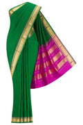 Green Kanchipuram Silk Saree with Plain Body and Zari Border.  displayed on a mannequin