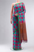 Multi Color Coimbatore Cotton Saree with Checked design on the body and Plain Border.  displayed on a mannequin