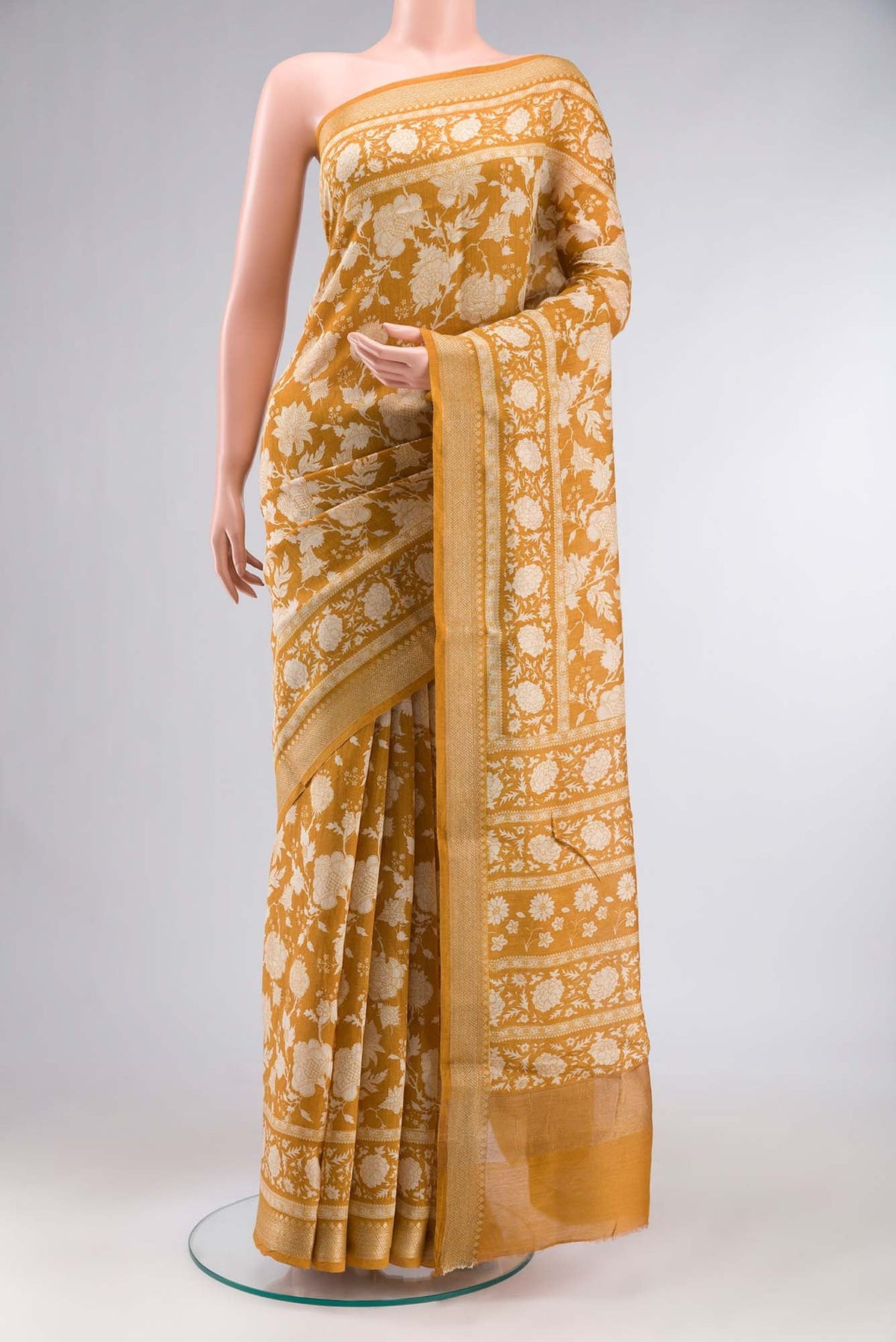 Yellow Bhagalpuri Tussar Silk Saree with Floral Print on the body and Zari Border.  displayed on a mannequin