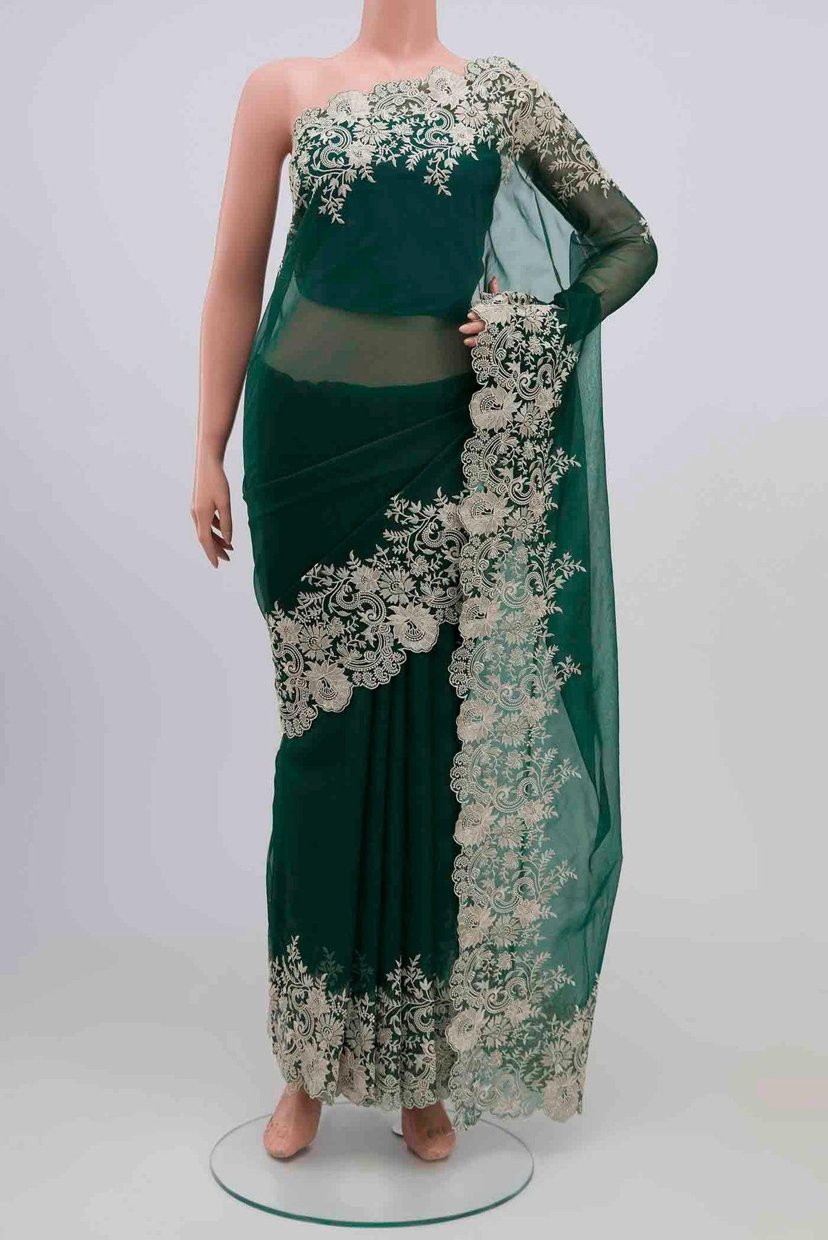 Green Blended Organza Silk Saree with Plain Body and Embroidery Border.  displayed on a mannequin