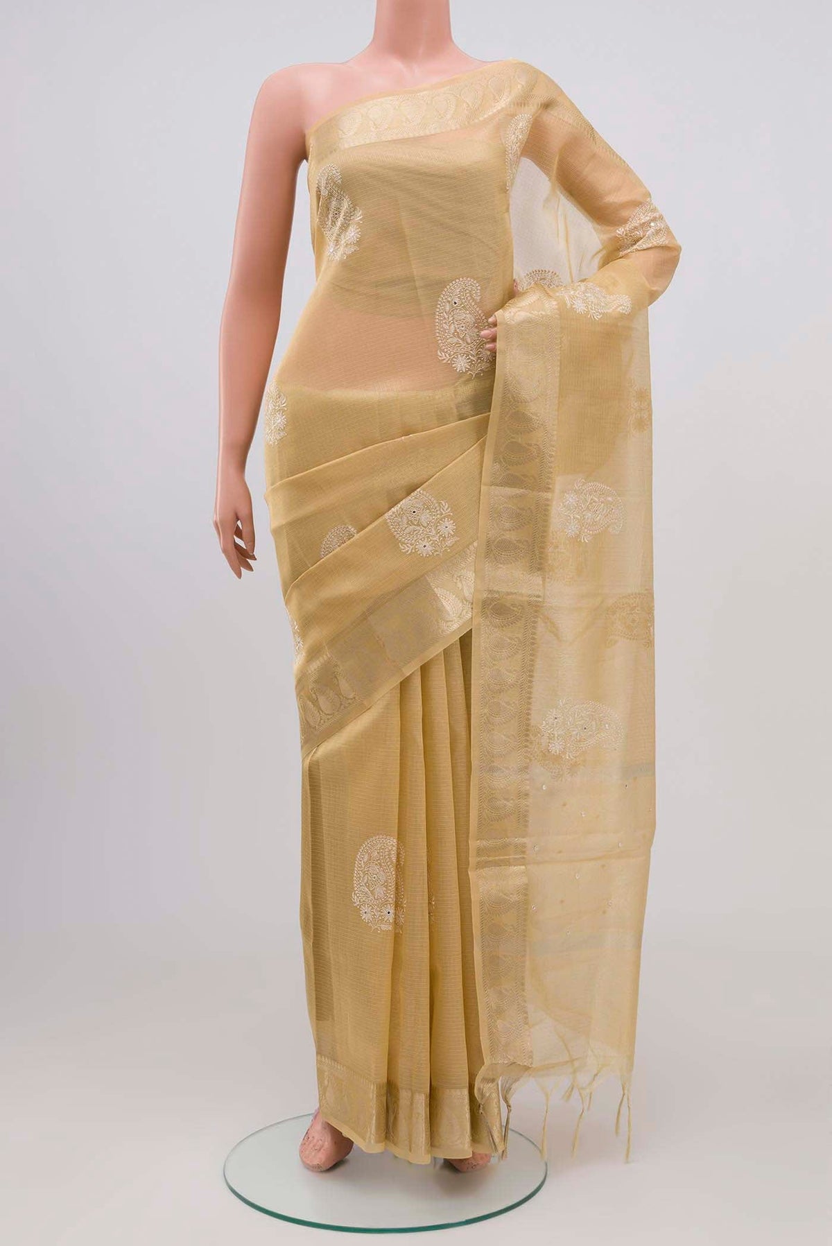 Sandal Blended Kota Silk Saree with Embroidery on the body and Zari Border.  displayed on a mannequin