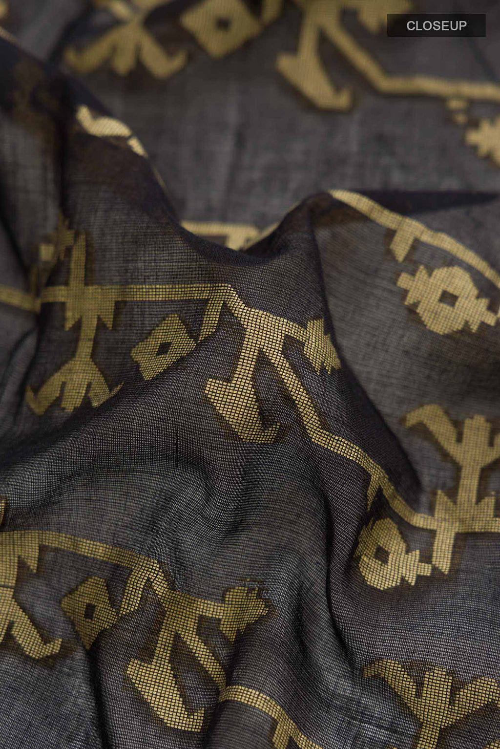 Close up of Black Bengal Cotton Saree with Jamdani on the body and Zari Border displaying folds