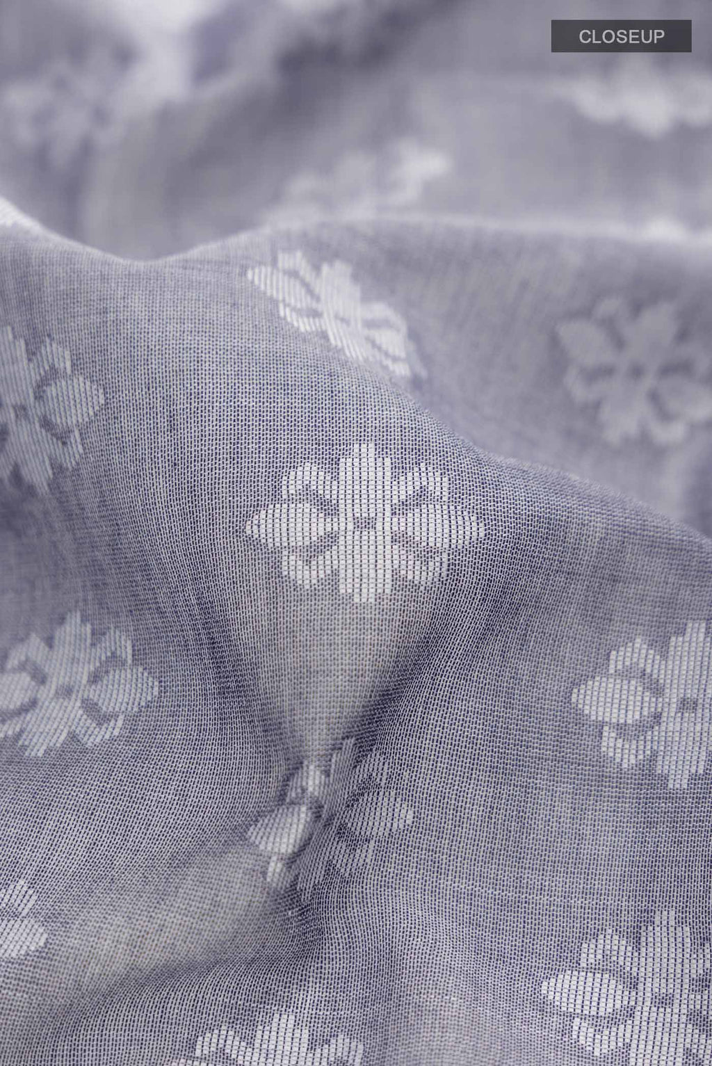Close up of Blue Bengal Cotton Saree with Jamdani on the body and Thread Border displaying folds