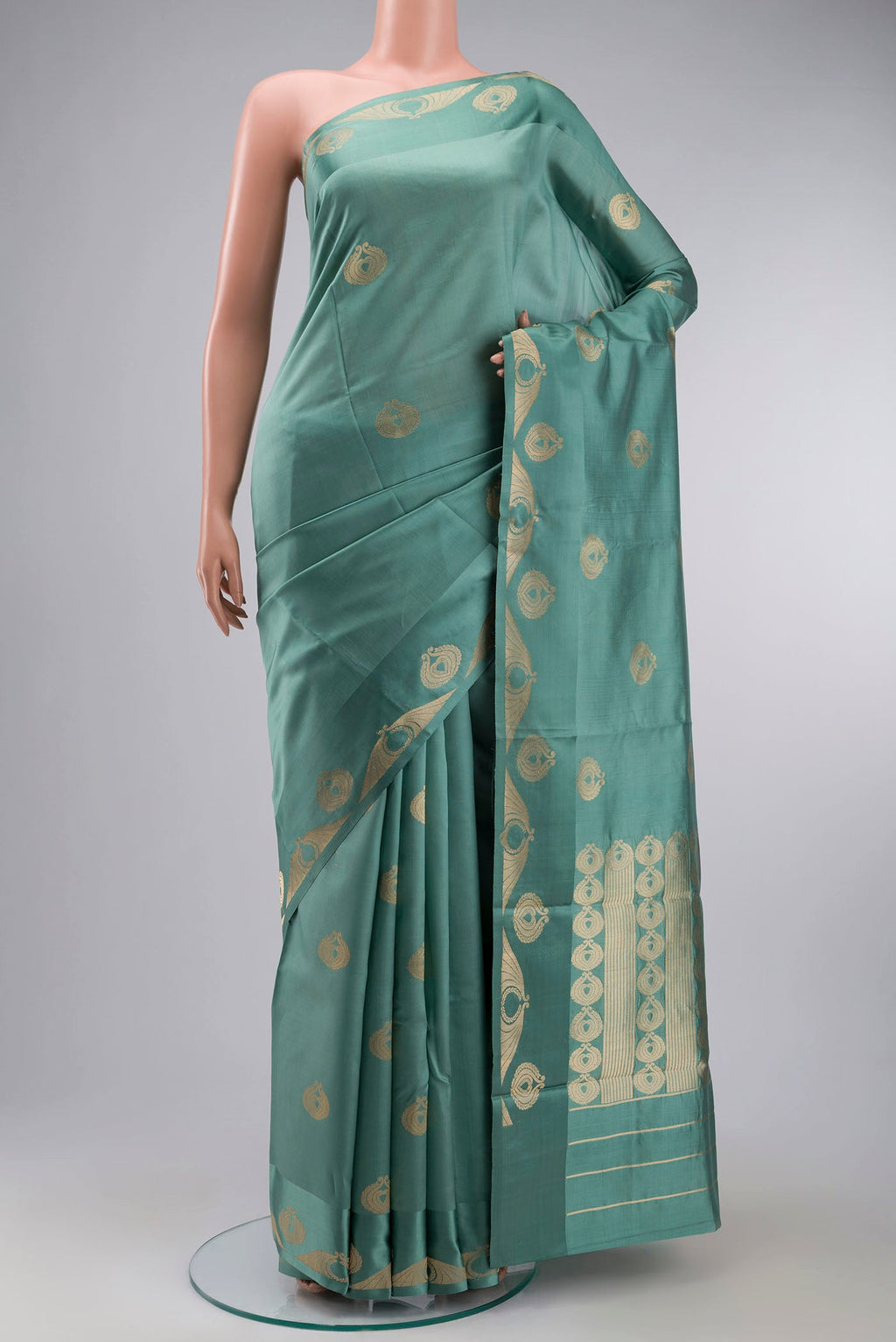 Green Banarasi Katan Silk Saree with Zari Butta on the body and Zari Border displayed on a mannequin