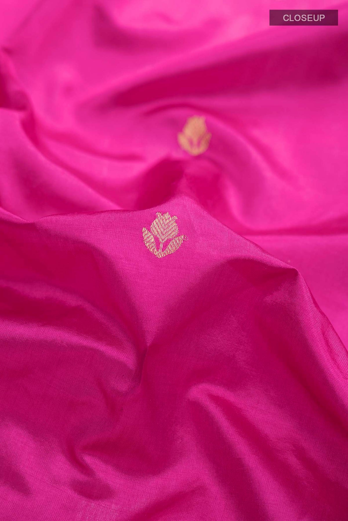 Close up of Pink Banarasi Katan Silk Saree with Zari Brocade on the body and Zari Border displaying folds