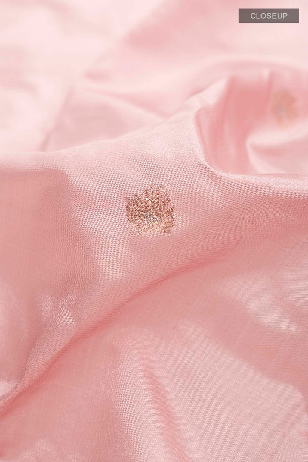 Close up of Pink Banarasi Katan Silk Saree with Zari Butta on the body and Zari Border displaying folds