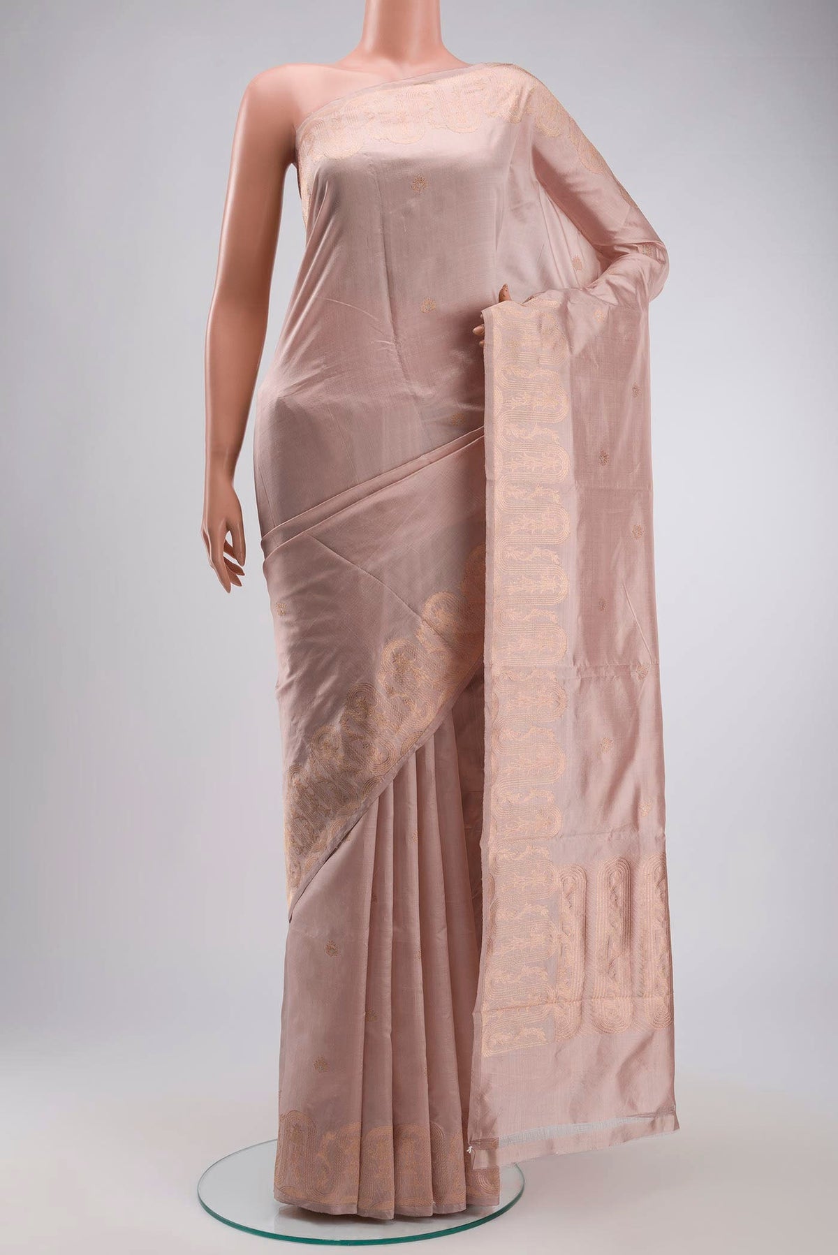 Rose Gold Banarasi Katan Silk Saree with Zari Butta on the body and Zari Border displayed on a mannequin