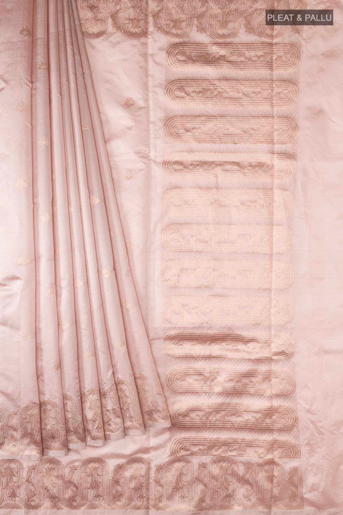 Pleats and pallu of Rose Gold Banarasi Katan Silk Saree with Zari Butta on the body and Zari Border