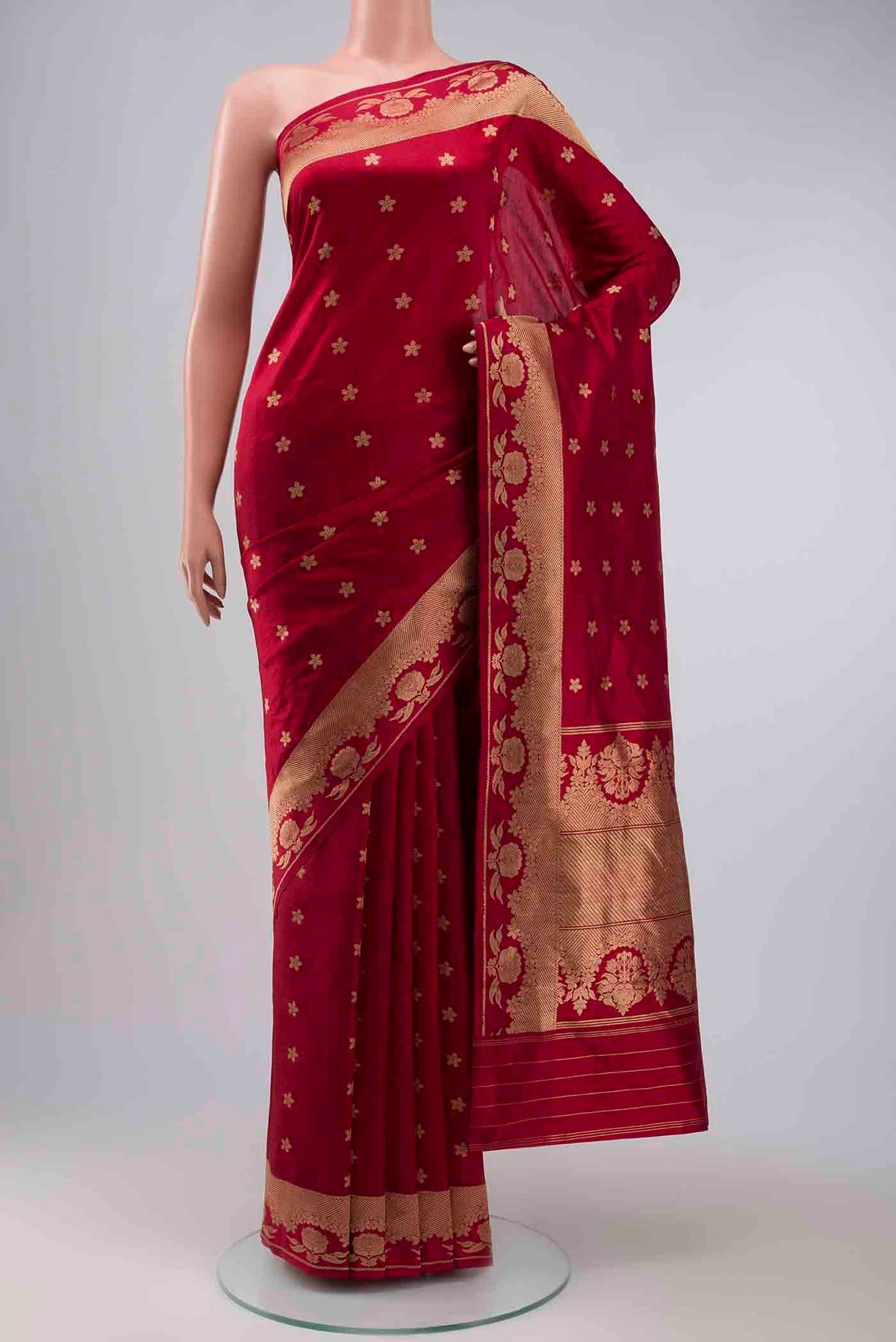 Maroon Banarasi Katan Silk Saree with Zari Butta on the body and Zari Border displayed on a mannequin