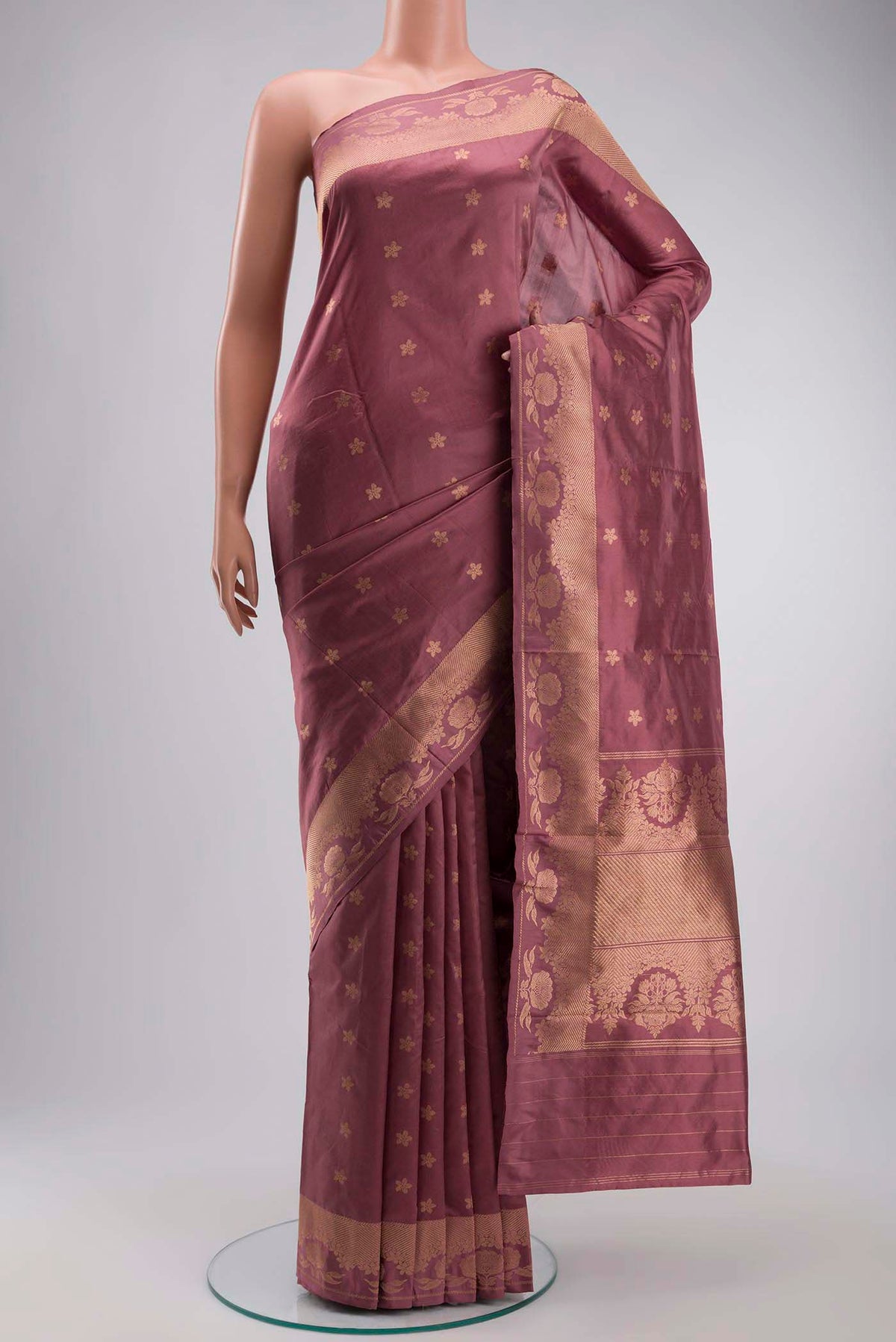 Coral Banarasi Katan Silk Saree with Zari Butta on the body and Zari Border displayed on a mannequin
