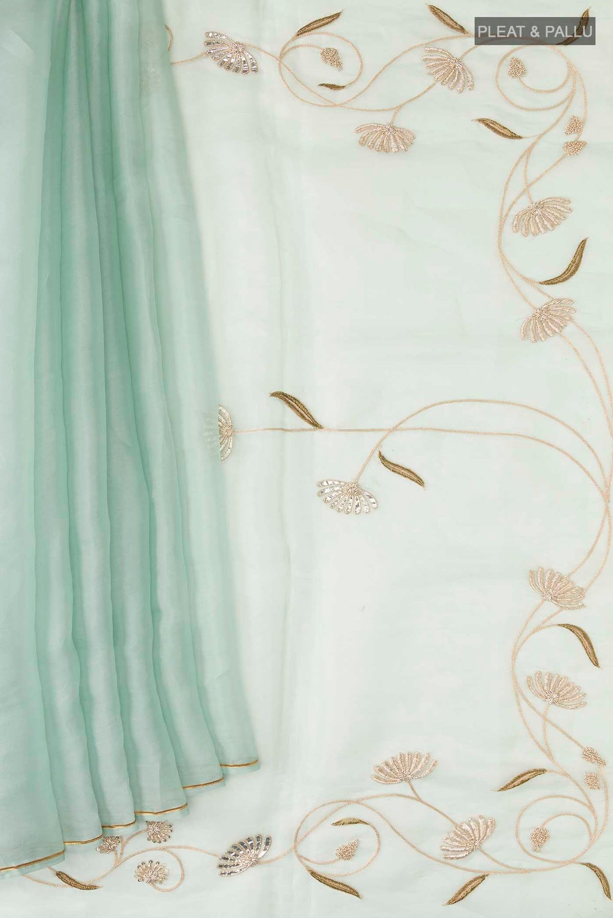 Pleats and pallu of Green Organza Silk Saree with Plain Body and Embroidery Border