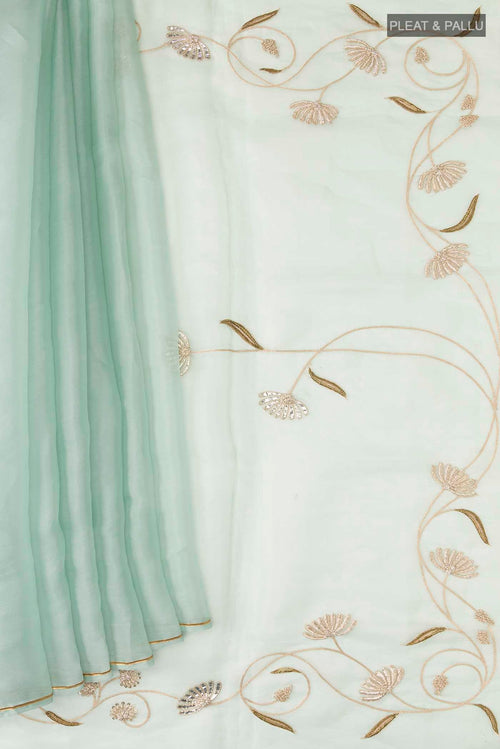 Pleats and pallu of Green Organza Silk Saree with Plain Body and Embroidery Border