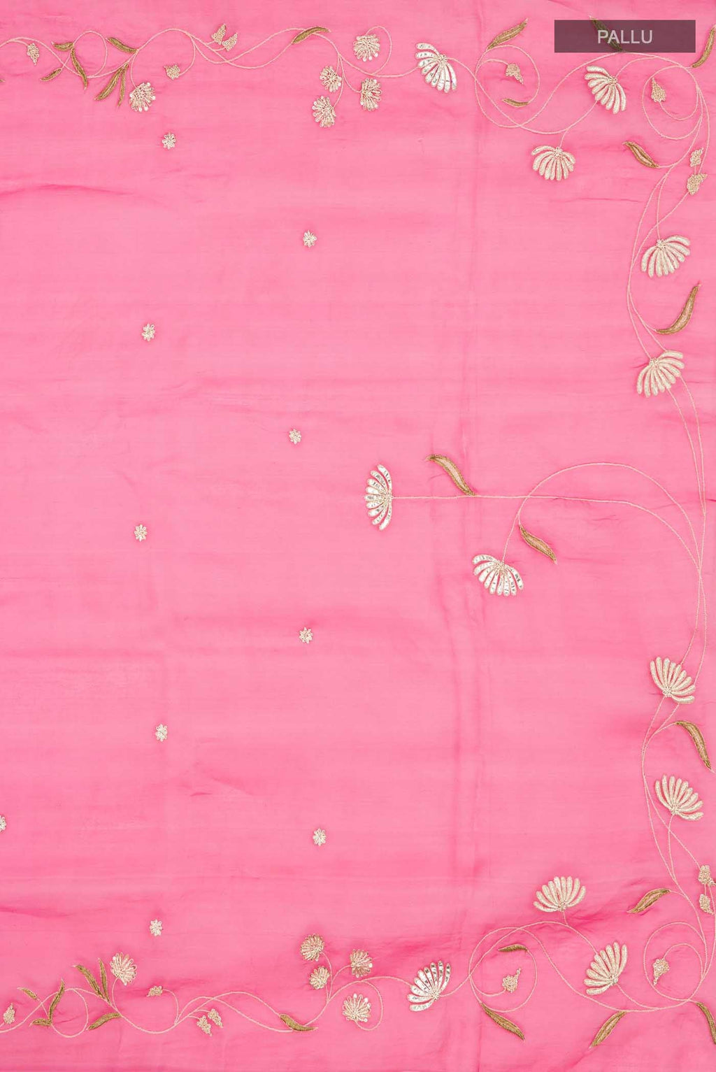 Close up image of the pallu of Bahar, crafted in silk organza, features delicate pani-zari enriched with zardozi, gota work, and dabka embroidery Its defining element is an off-center floral vine running vertically through the body, breaking symmetry with quiet intent Inspired by Art Nouveau?s flowing lines, the vine is rendered in slender leaves, zari chain-stitched stems, and alternating gota and zardozi flowers The pallu trails gently onto the body in scattered embroidered blooms