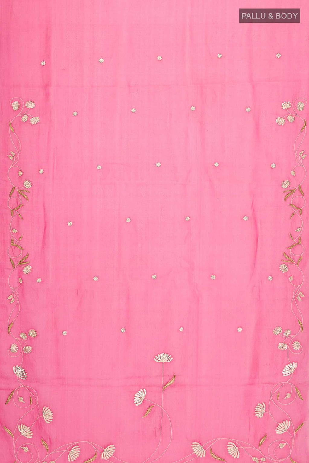Flat view of Bahar, crafted in silk organza, features delicate pani-zari enriched with zardozi, gota work, and dabka embroidery Its defining element is an off-center floral vine running vertically through the body, breaking symmetry with quiet intent Inspired by Art Nouveau?s flowing lines, the vine is rendered in slender leaves, zari chain-stitched stems, and alternating gota and zardozi flowers The pallu trails gently onto the body in scattered embroidered blooms