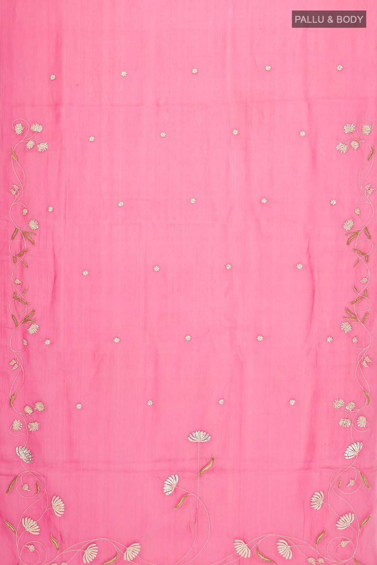 Flat view of Bahar, crafted in silk organza, features delicate pani-zari enriched with zardozi, gota work, and dabka embroidery Its defining element is an off-center floral vine running vertically through the body, breaking symmetry with quiet intent Inspired by Art Nouveau?s flowing lines, the vine is rendered in slender leaves, zari chain-stitched stems, and alternating gota and zardozi flowers The pallu trails gently onto the body in scattered embroidered blooms