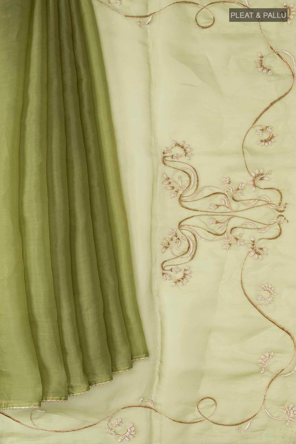 Pleats and pallu of Green Organza Silk Saree with Plain Body and Embroidery Border