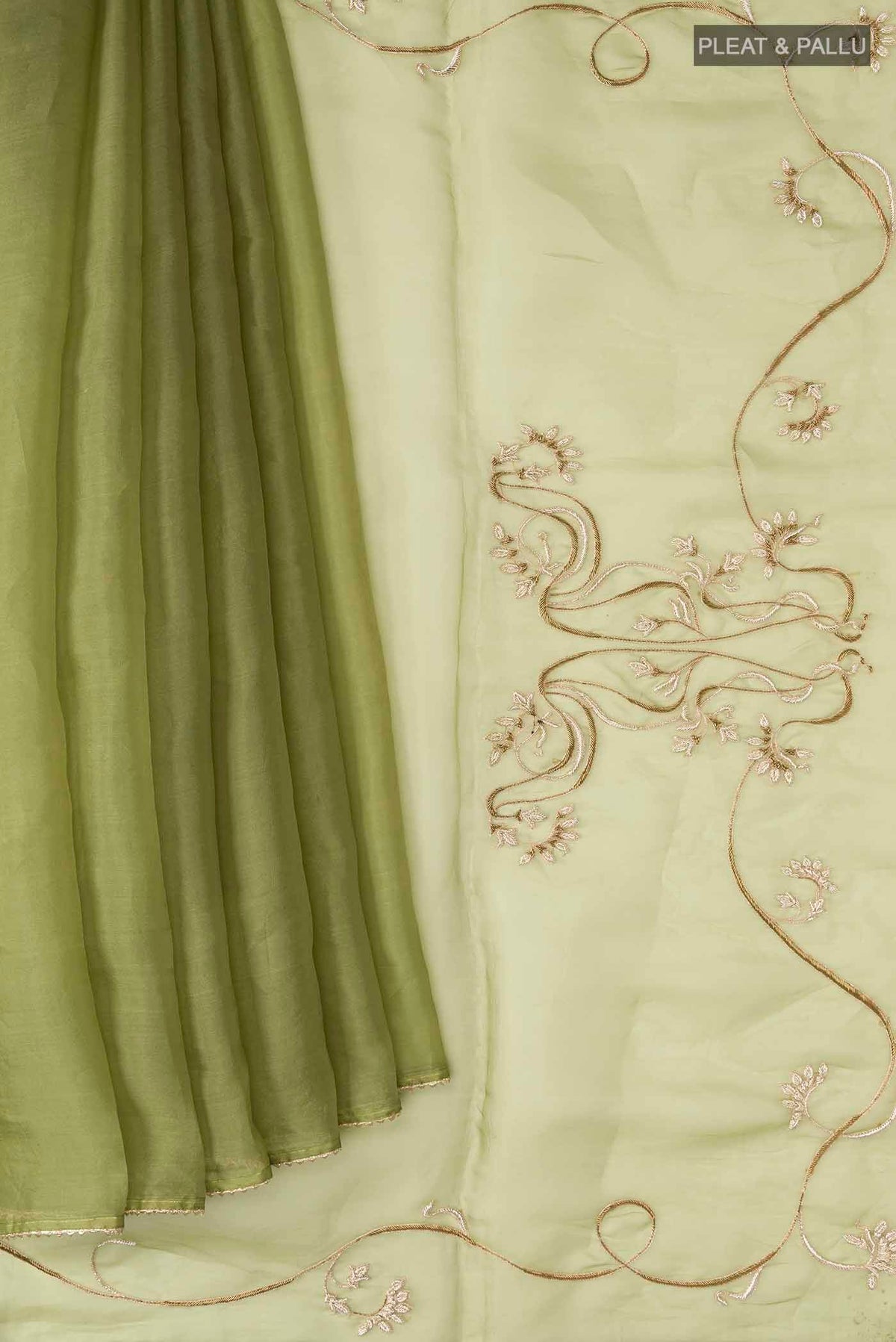 Pleats and pallu of Green Organza Silk Saree with Plain Body and Embroidery Border