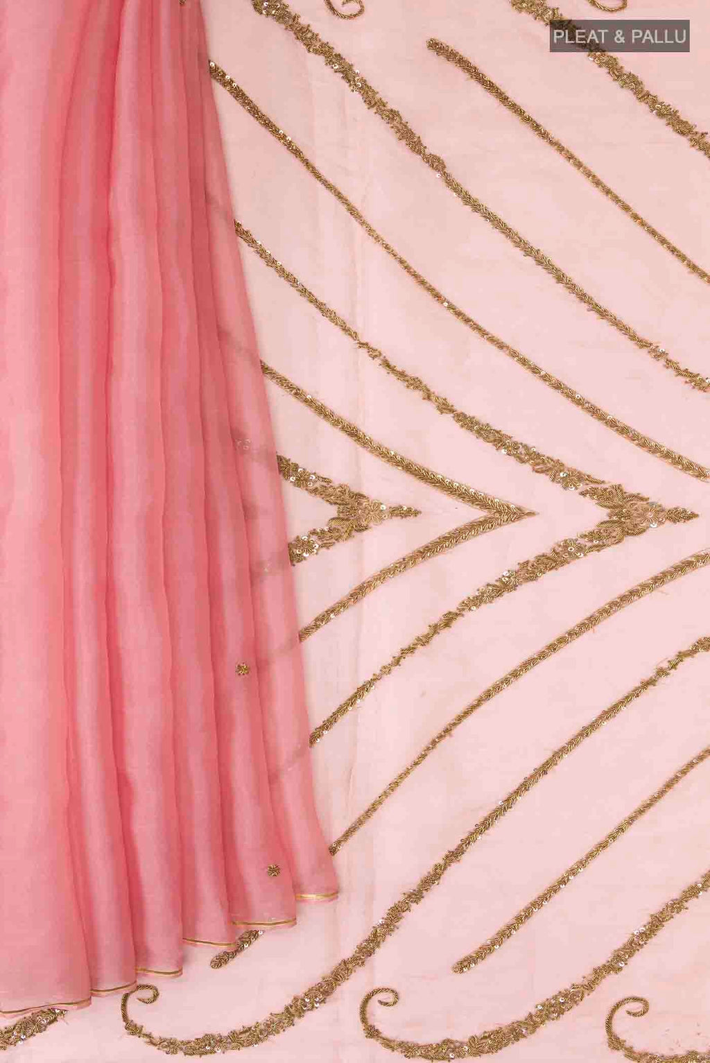 Pleats and pallu of Pink Organza Silk Saree with Embroidery on the body and Zari Border