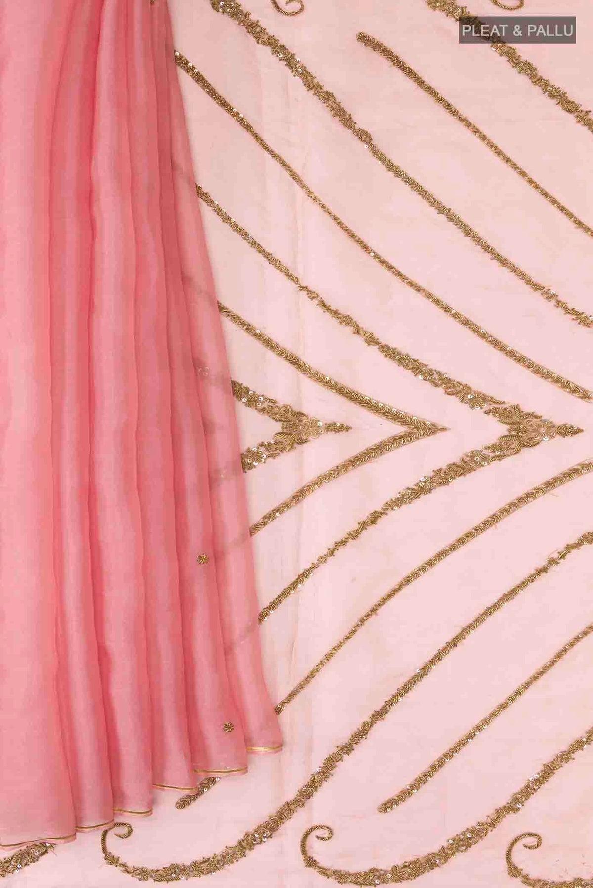 Pleats and pallu of Pink Organza Silk Saree with Embroidery on the body and Zari Border