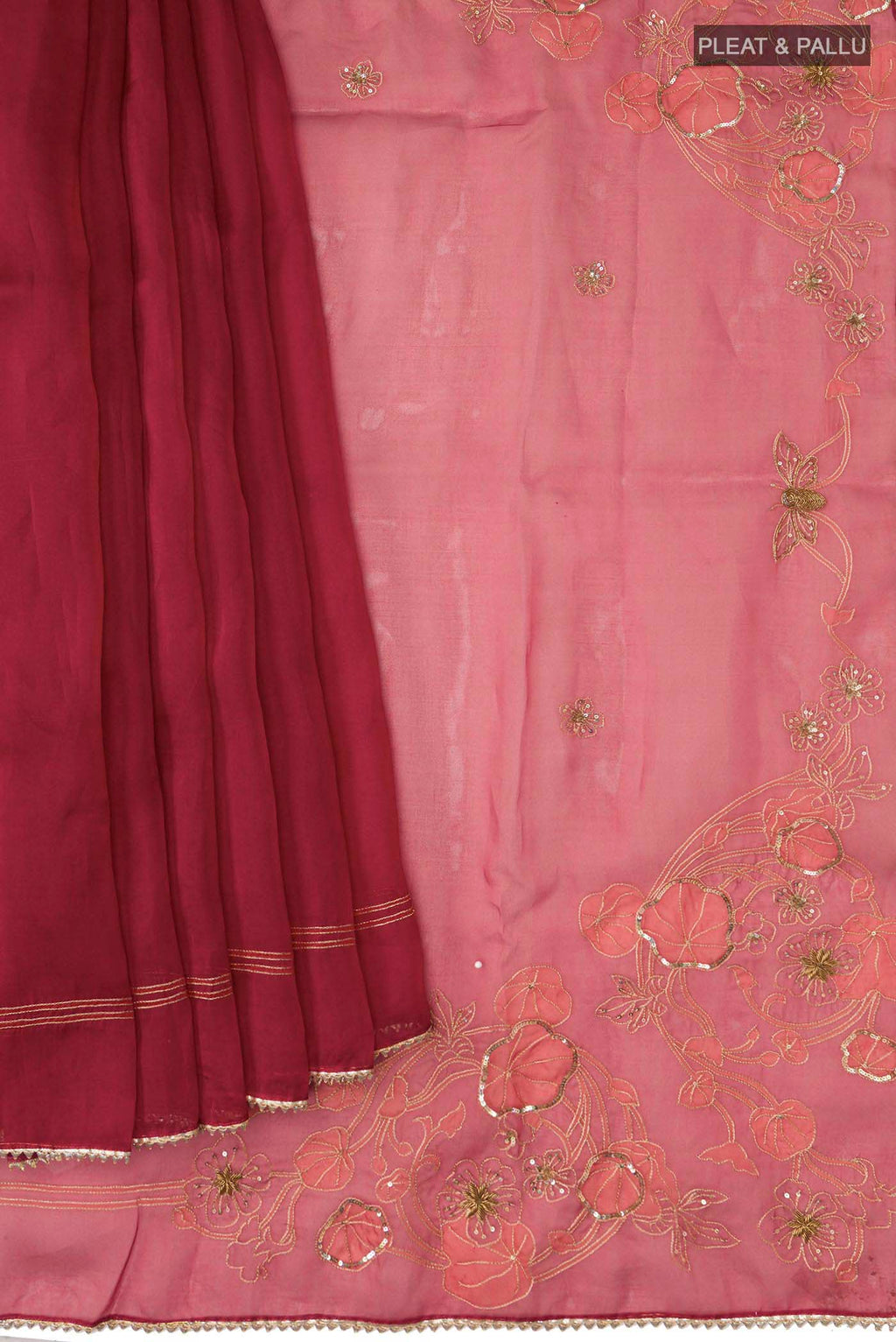 Pleats and pallu of Maroon Organza Silk Saree with Embroidery on the body and Embroidery Border