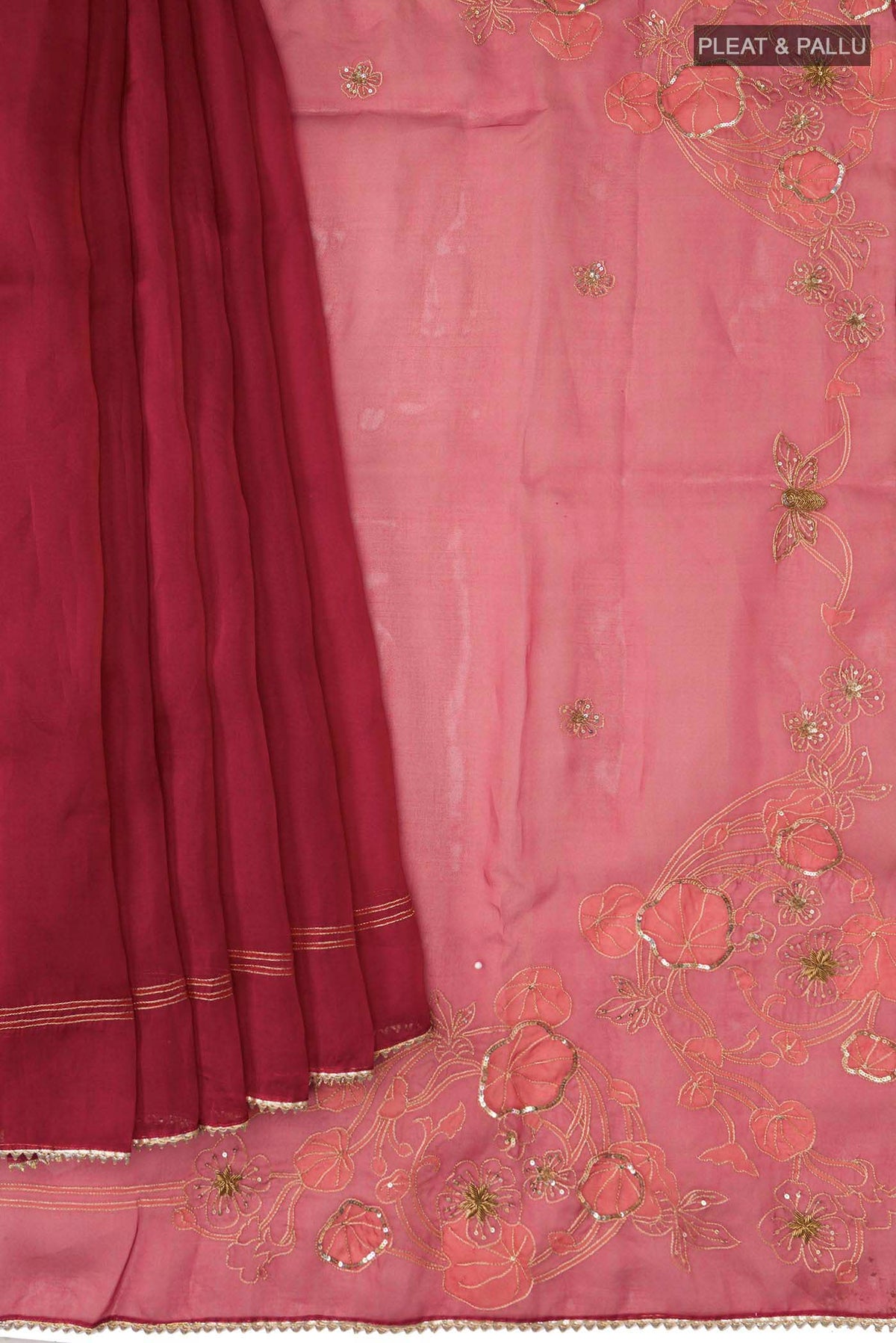 Pleats and pallu of Maroon Organza Silk Saree with Embroidery on the body and Embroidery Border