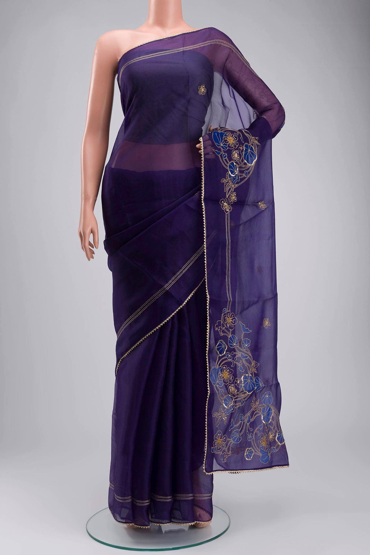 Navy Blue Organza Silk Saree with Plain Body and Embroidery Border displayed on a mannequin