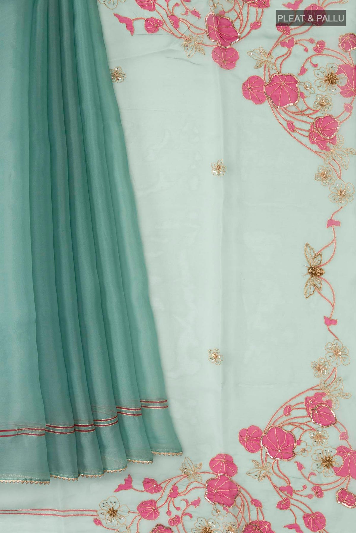 Pleats and pallu of Green Organza Silk Saree with Plain Body and Embroidery Border