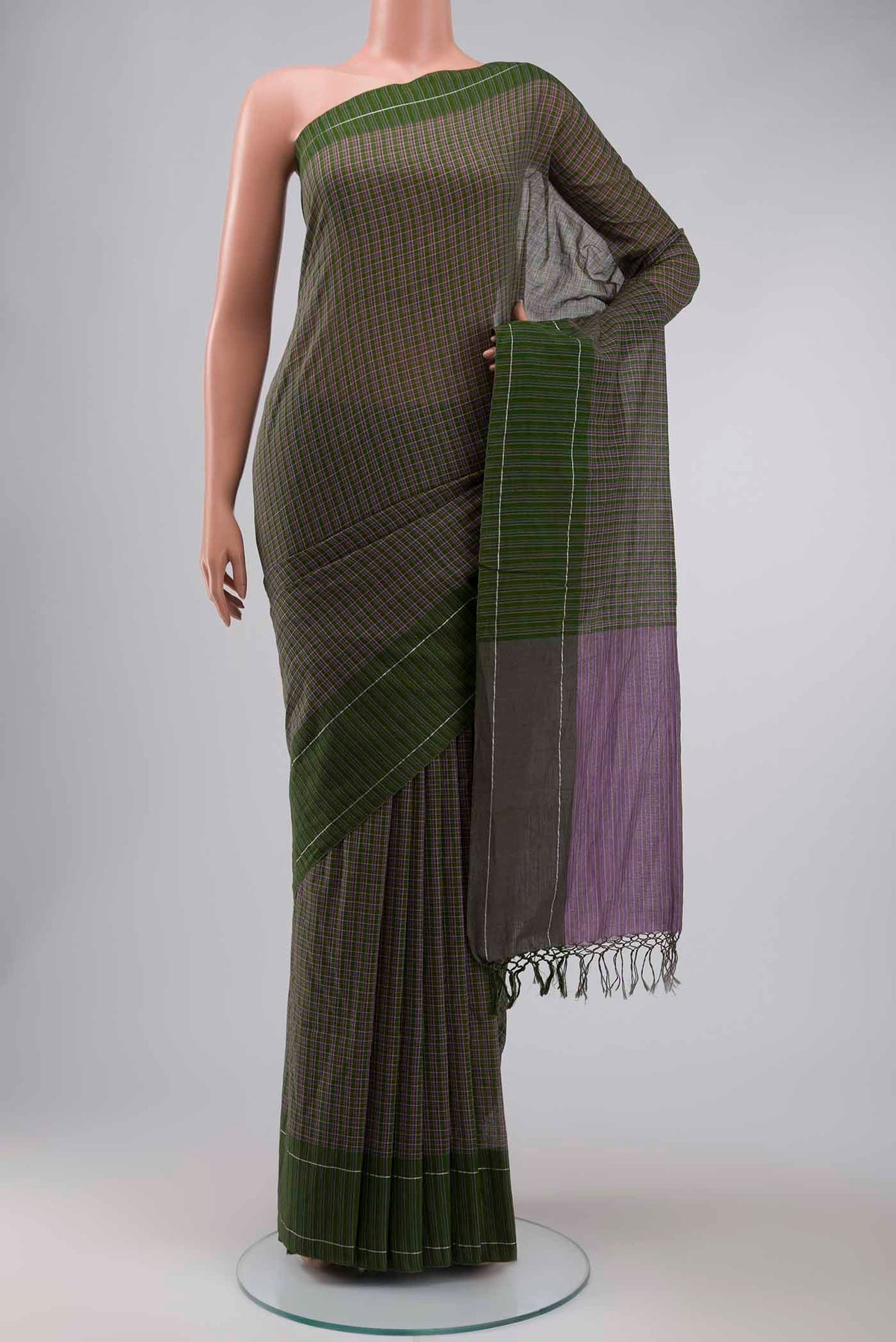 Patang features fine multi-coloured checks woven using four harmonious hues, creating a lively yet balanced design Translating to ?te)n Hindi, the saree reflects the light, easy spirit of a patang gliding across an open sky The border and pallu are minimal, finished with delicate zari accents that add subtle richness With its balanced play of colour, it makes for a breathable, comfortable drape displayed on a mannequin