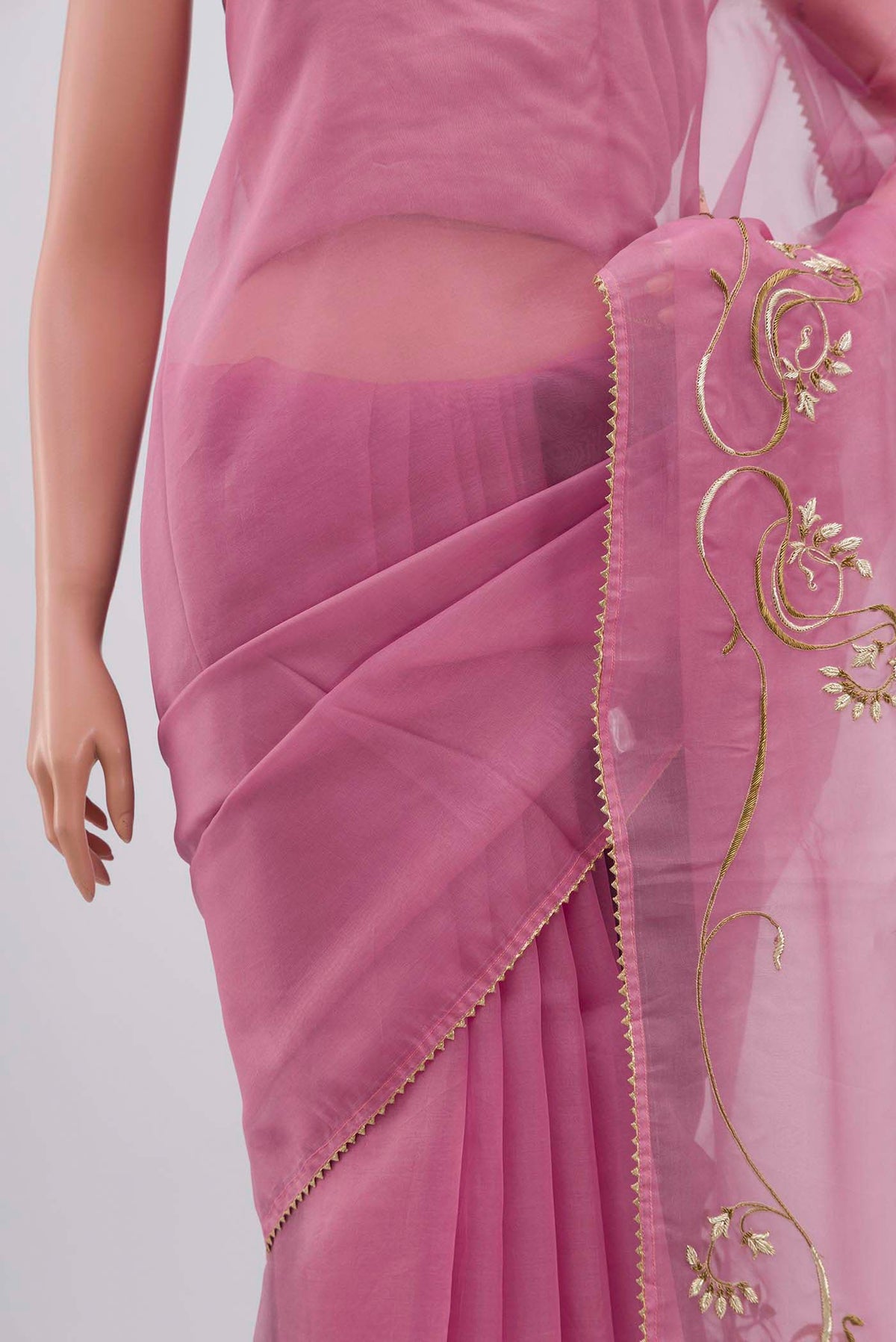 Close up image of the pallu of Rose pink Organza Silk Saree with Embroidery on the body and Attached Border